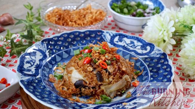 Cantonese Cabbage and Mushroom Rice served on a blue antique plate with crispy shallots and spring onions