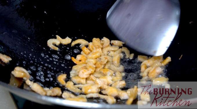 Dried shrimps being fried in a wok