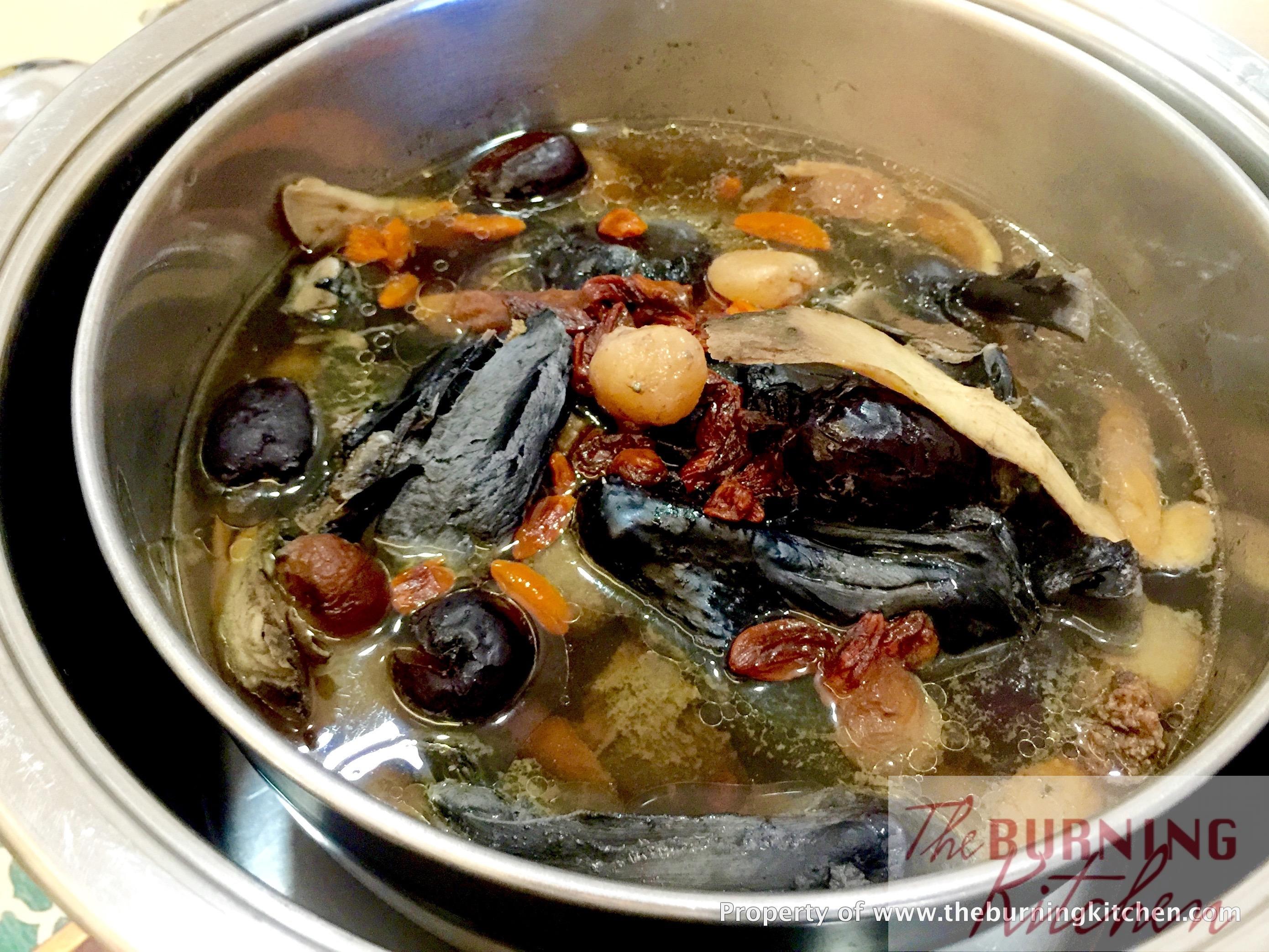 Herbal Black Chicken Soup Double Boiling in bigger pot.