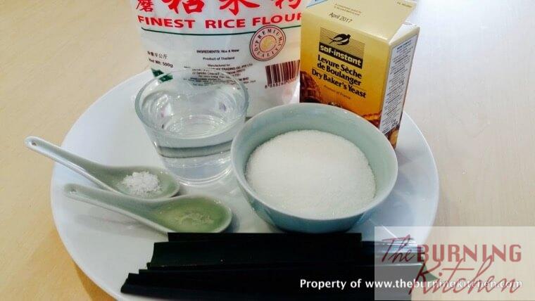 pandan leaves, sugar, yeast, rice flour, water, salt on a white plate 