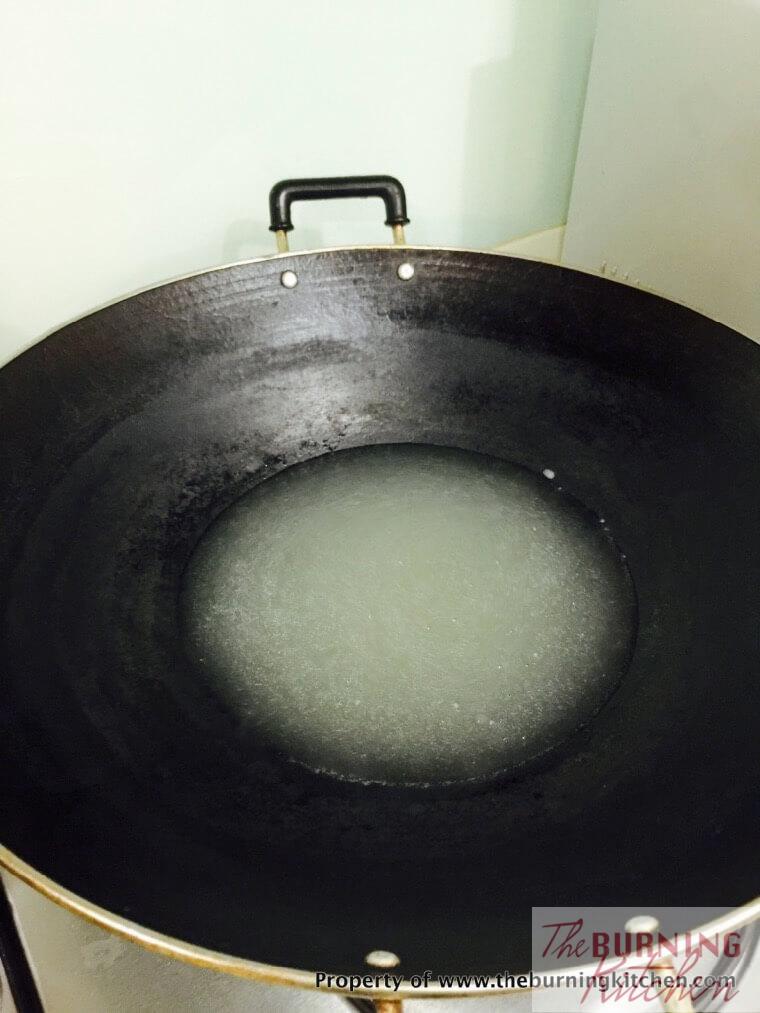 ikan bilis stock in a wok