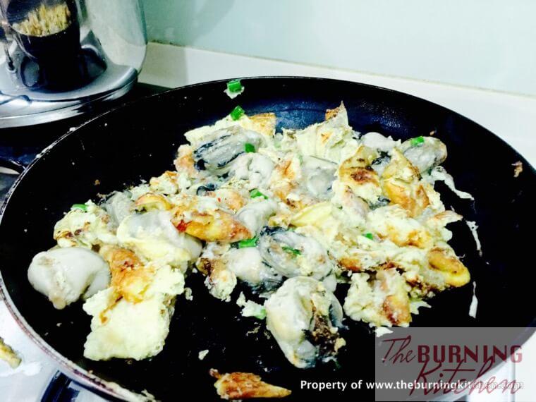 fried oyster omelette with chopped spring onions 
