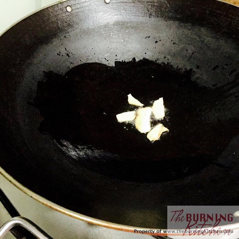 Frying ginger in wok