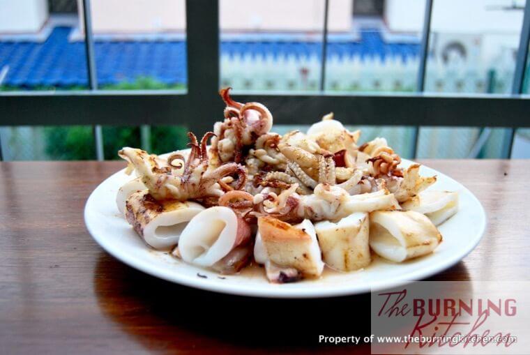 Cut fried squid in white plate
