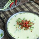Chinese Steamed Egg with Minced Meat, garnished with red chillies and spring onions
