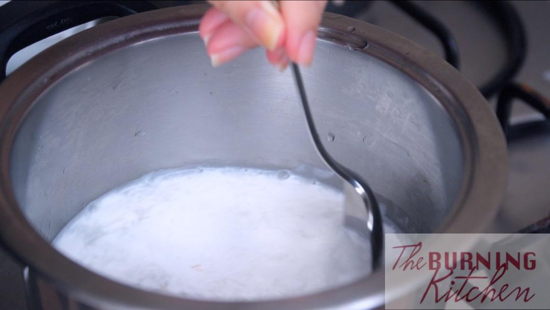 stirring the coconut soup