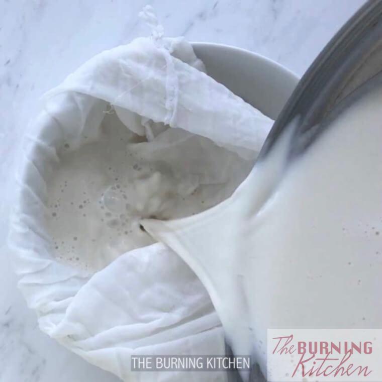 Sieving blended soy bean milk mixture through muslin cloth