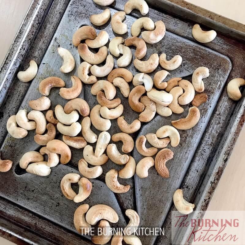 Toasting cashew nuts on baking tray