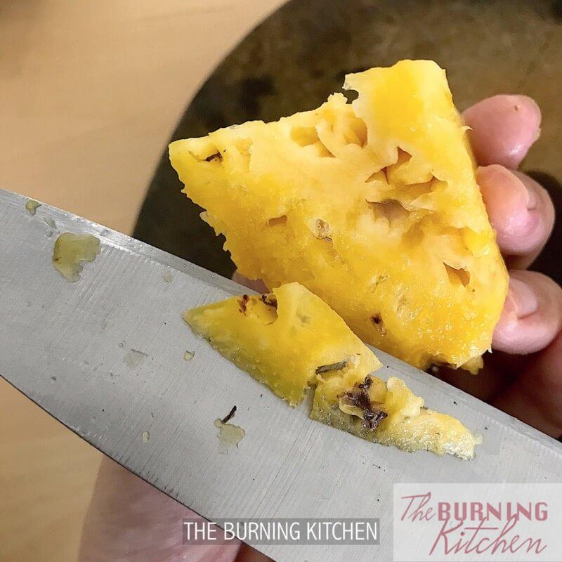 Removing eyes of pineapple