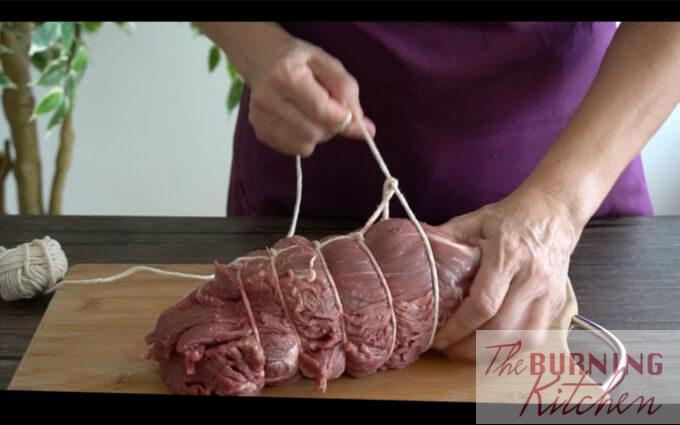 How to Tie a Roast: Tying a roast helps to retain a nice round shape during roasting, and also allows it to cook more evenly.