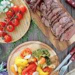 Roast Beef Tenderloin with cherry tomatoes and salad on the side