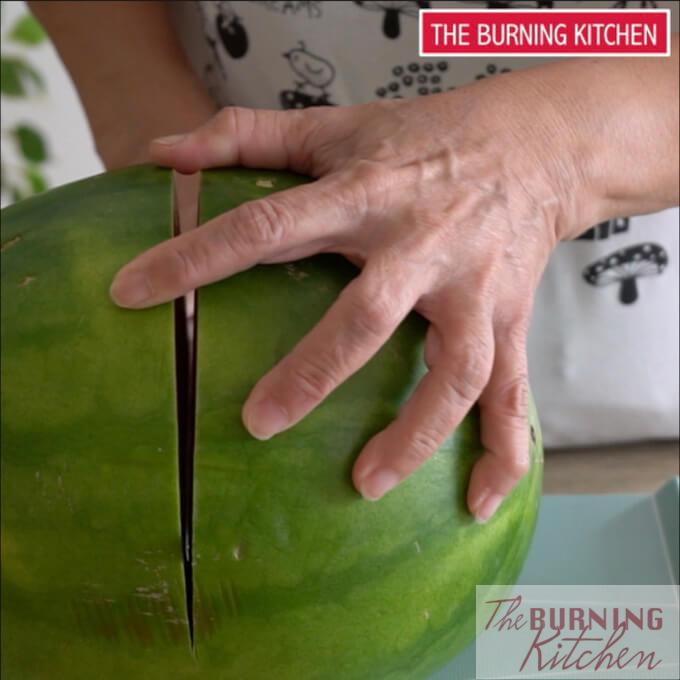 Cutting a watermelon in half