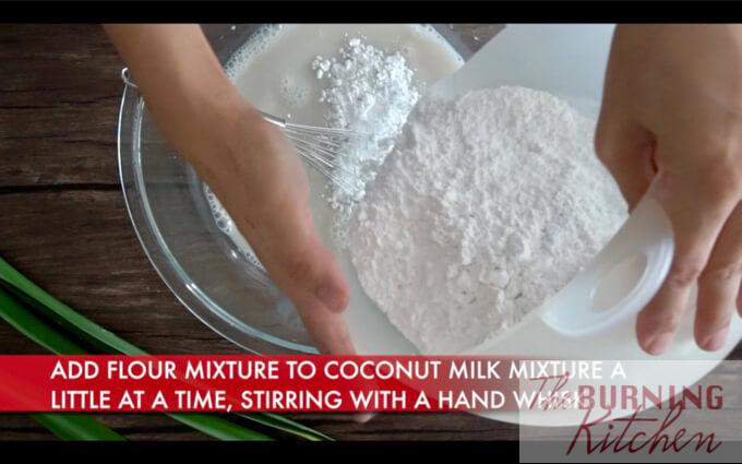 Adding flour into a glass bowl with coconut milk