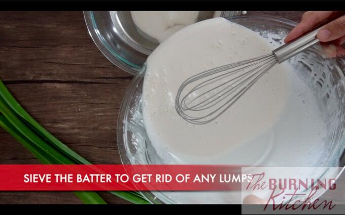 Mixing batter and pouring it into a smaller glass bowl